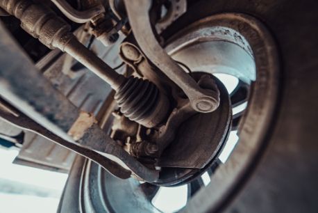 A Close Up of the Underside of a Car 's Suspension System — Border Power Steering Service In Lavington, NSW