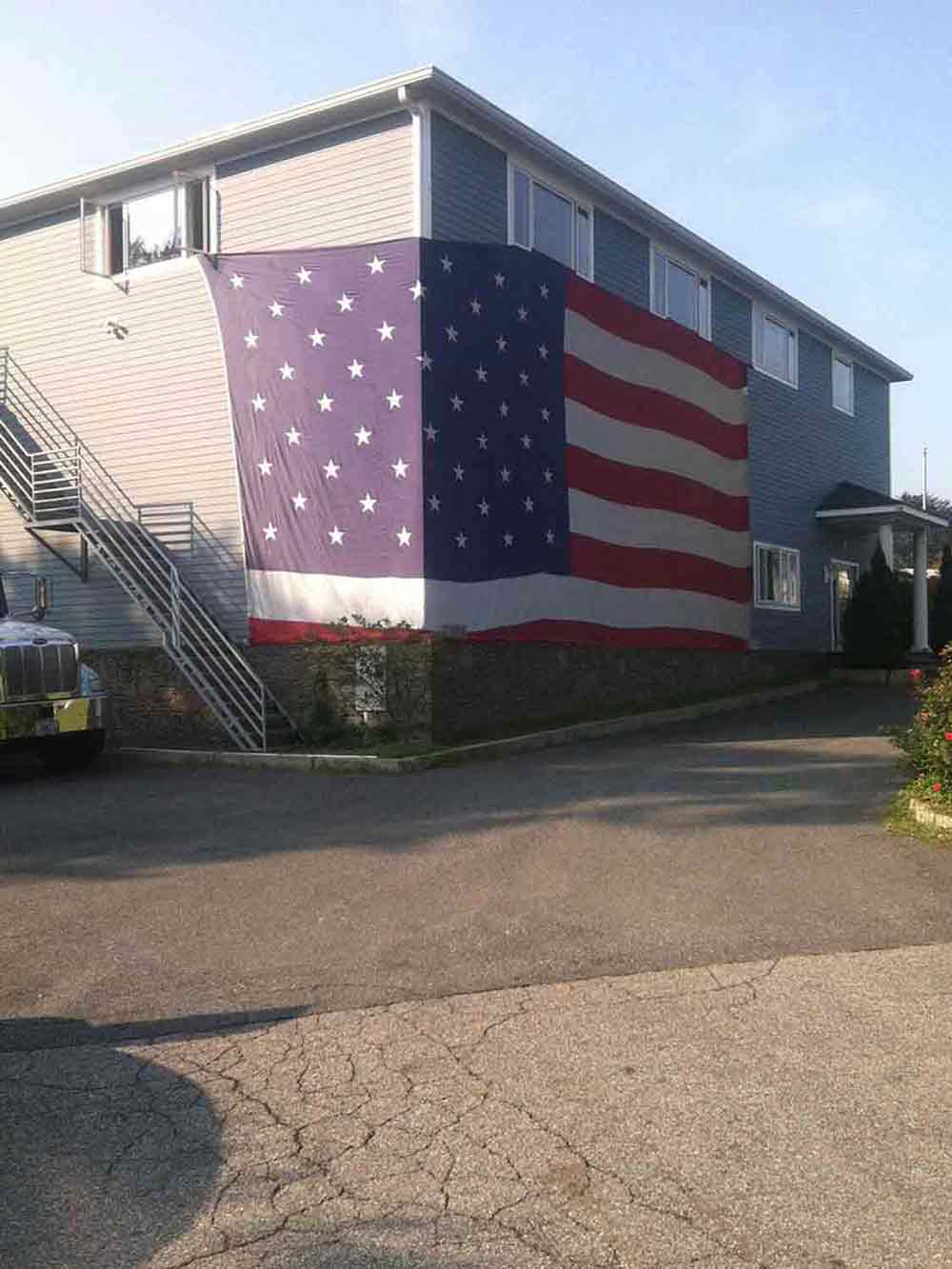 Air Conditioning Near Me — Building with Flag on the Wall in Middletown, RI