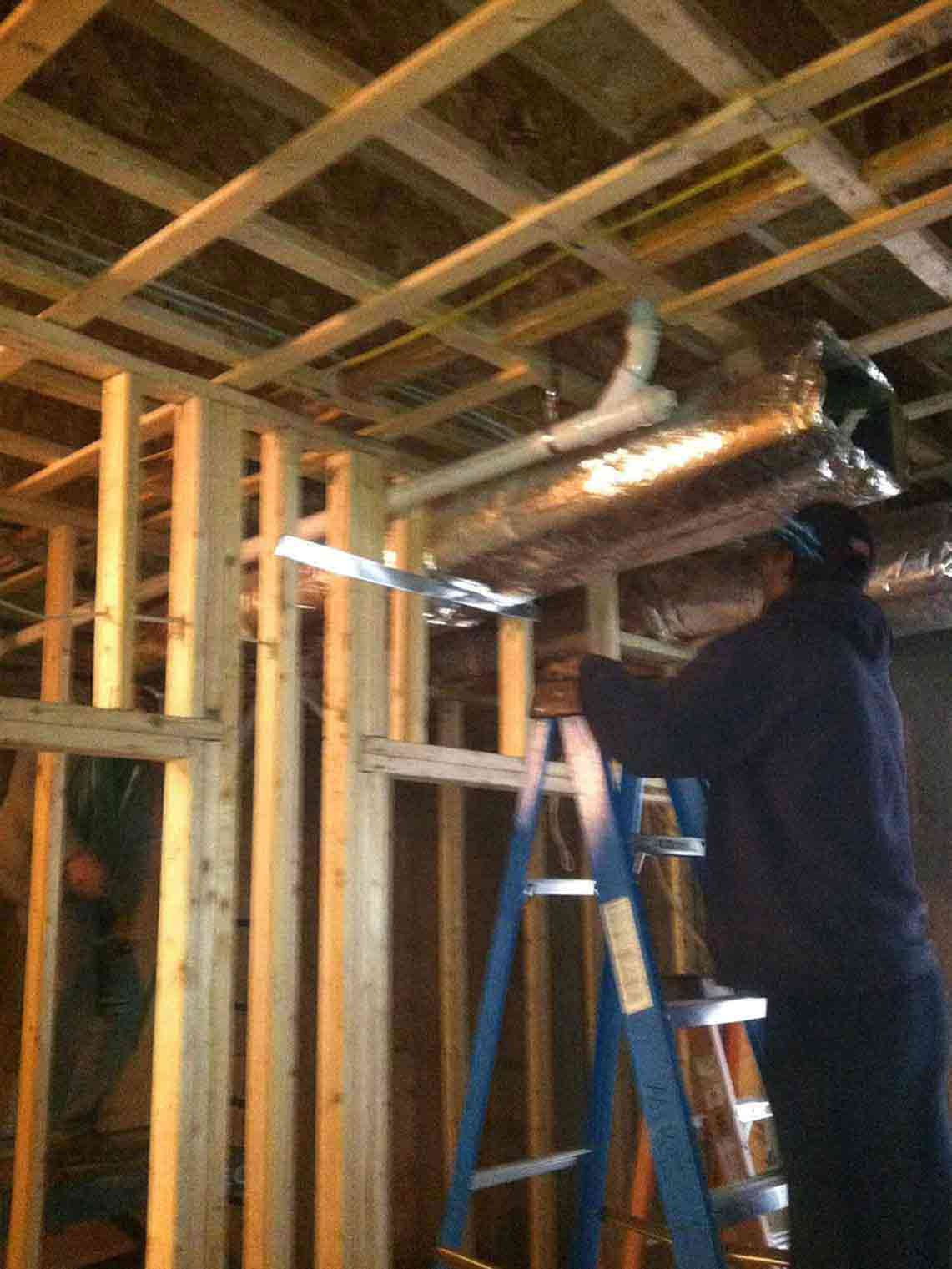 Air Conditioning — Man Fixing in Middletown, RI