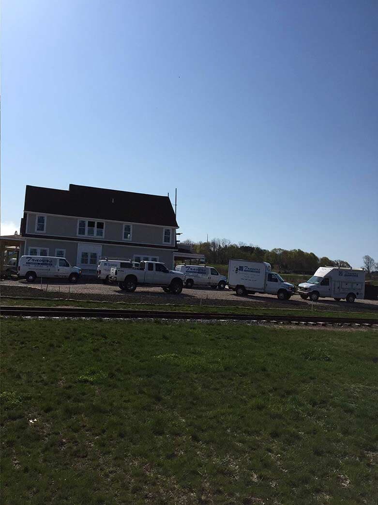 Plumbing Solutions — House with Cars Infront in Middletown, RI