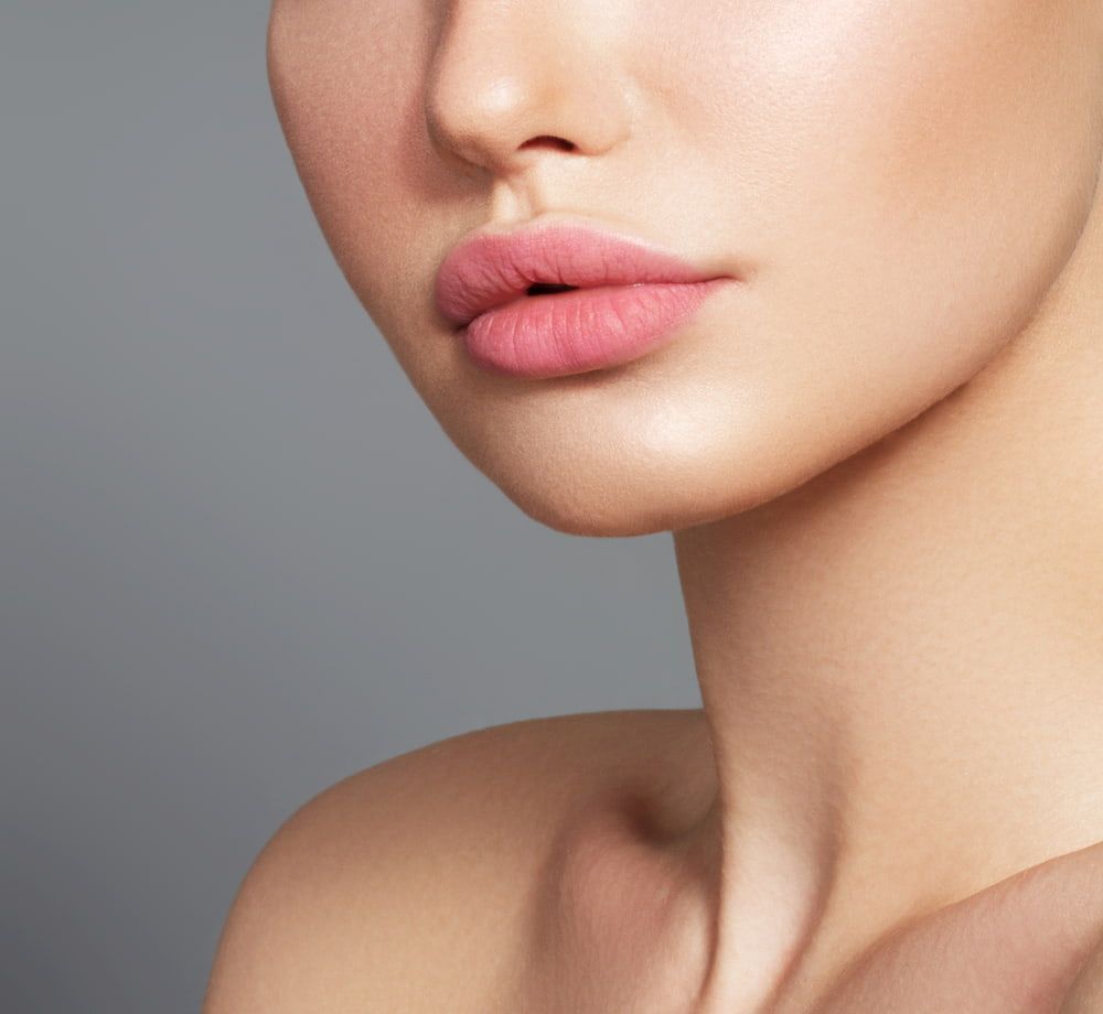 A Close up Of a Woman's Face with Pink Lips — Skin Exquisite Laser & Cosmetic Clinic in Port Macquarie, NSW