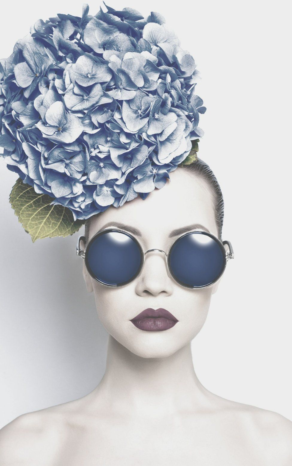 A Woman Wearing Sunglasses and A Blue Flower on Her Head — Skin Exquisite Laser & Cosmetic Clinic in Port Macquarie, NSW