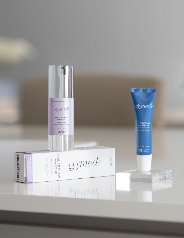 A Group of Bottles Sitting on Top of Each Other on A Table — Skin Exquisite Laser & Cosmetic Clinic in Port Macquarie, NSW