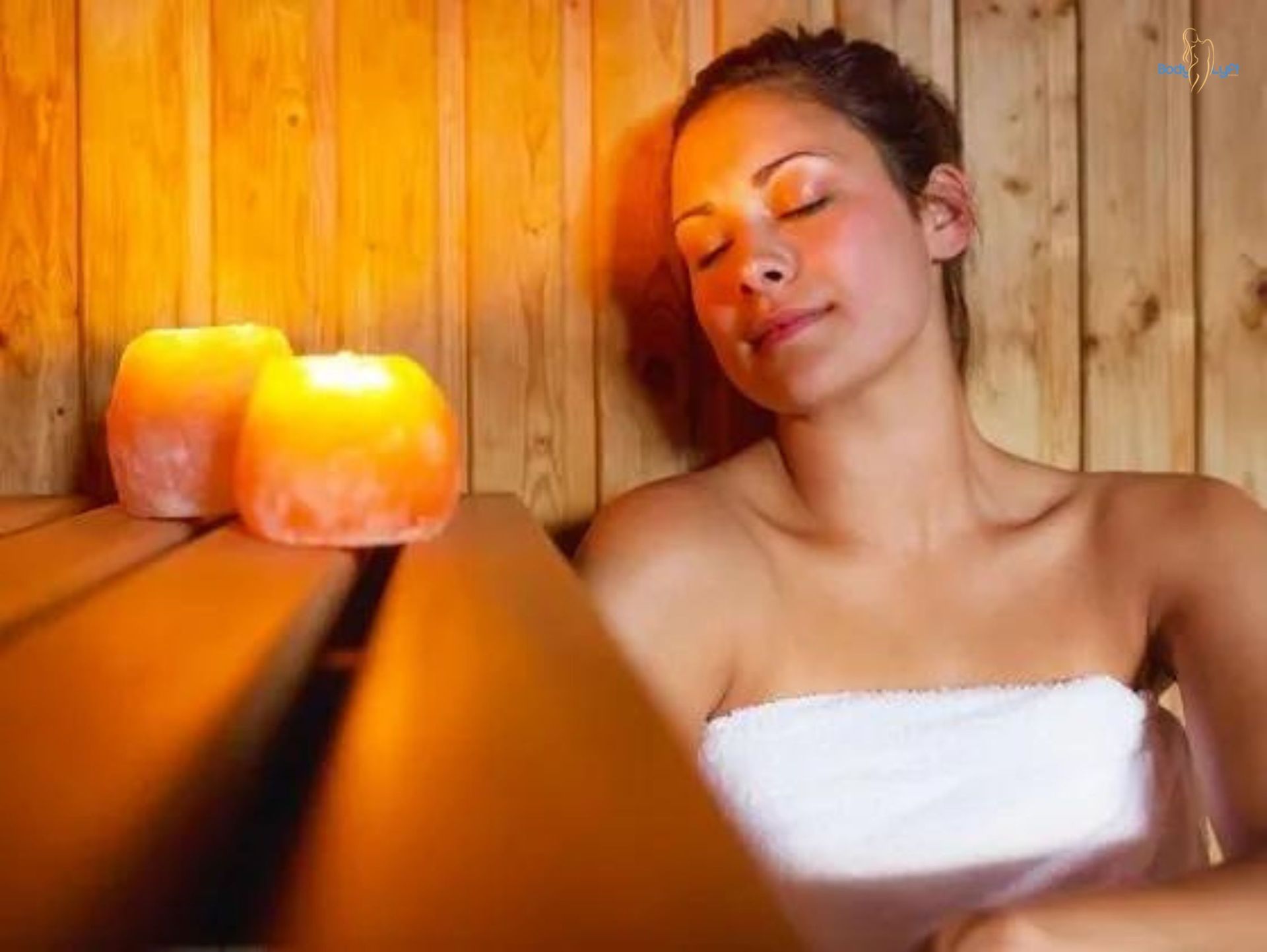 Client enjoying skin purification in infrared sauna