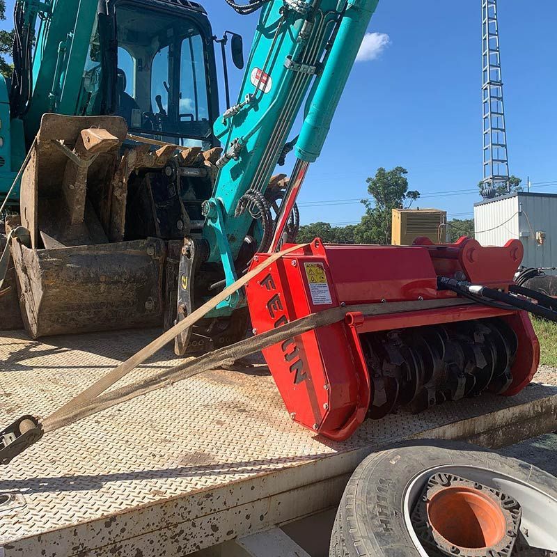 A Red Bucket With The Word Falcon On It — Atholyn Earthmovers in Wyee, NSW