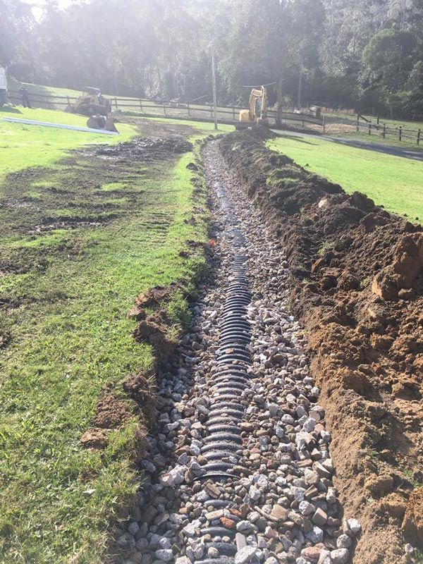 A Drainage System With Black Pipe — Atholyn Earthmovers in Singleton, NSW  
