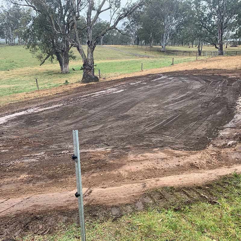 A Dirt Road With A Fence And Trees In The Background — Atholyn Earthmovers in Singleton, NSW