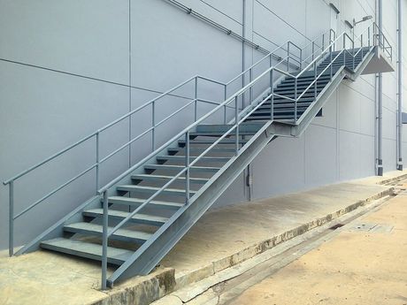 a metal stairs with railings