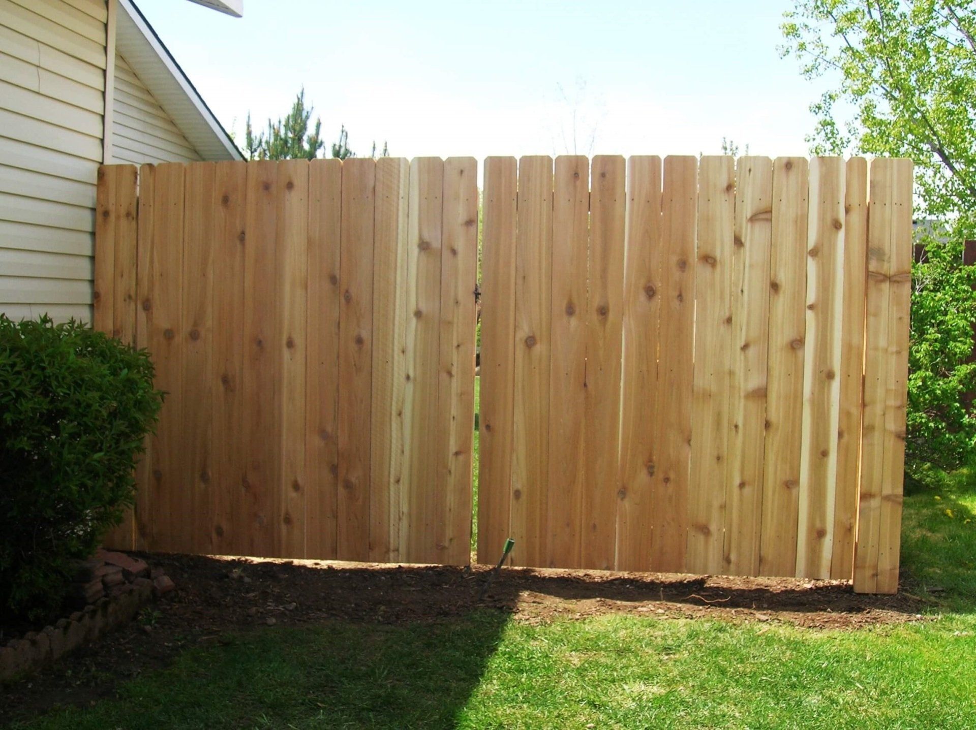 Newly Installed Dogear Wood Fence — Hayden, ID — American Fence Company