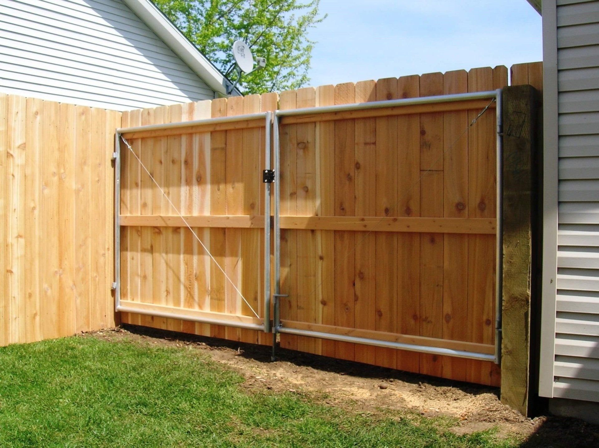 Dogear Wood Fence with Metal — Hayden, ID — American Fence Company
