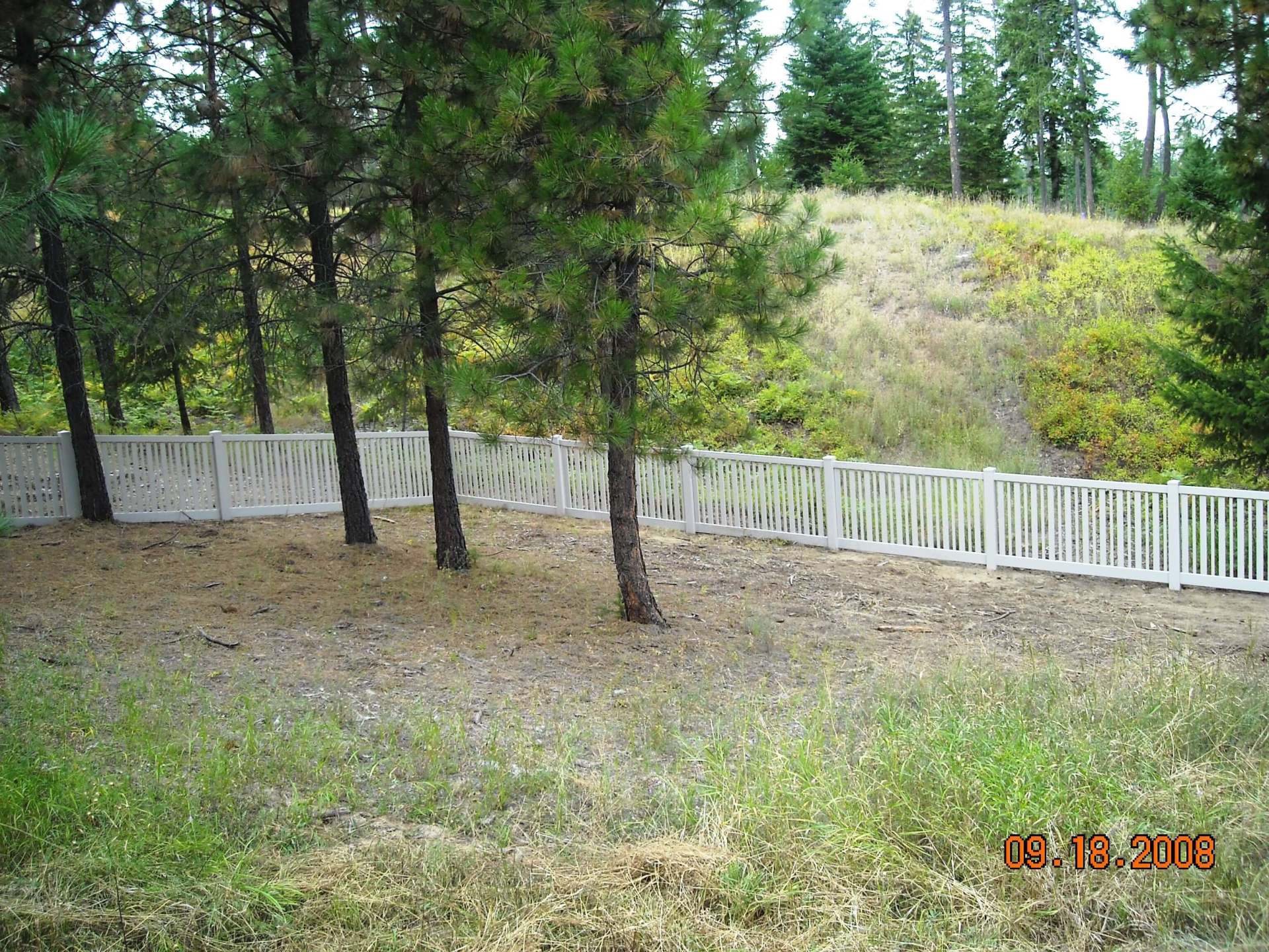 White Fences in a Vacant Lot — Hayden, ID — American Fence Company