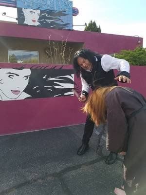 Hair Salon — Woman Lowering Her Head in Albuquerque, NM