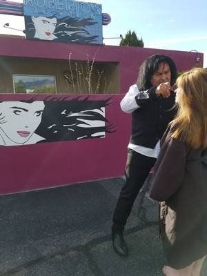 Hair Care — Stylist Combing The Woman's Hair in Albuquerque, NM