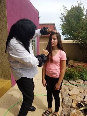 Hair Products — Stylist Aligning The Girl's Hair in Albuquerque, NM