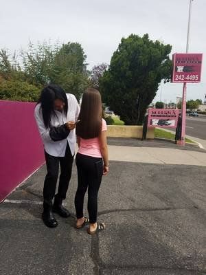 Bath of Color — Stylist Combing The Girl's Hair in Albuquerque, NM