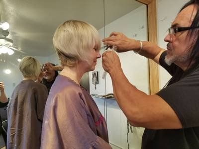 Chin Wax — Stylist Cutting The Customer's Hair in Albuquerque, NM