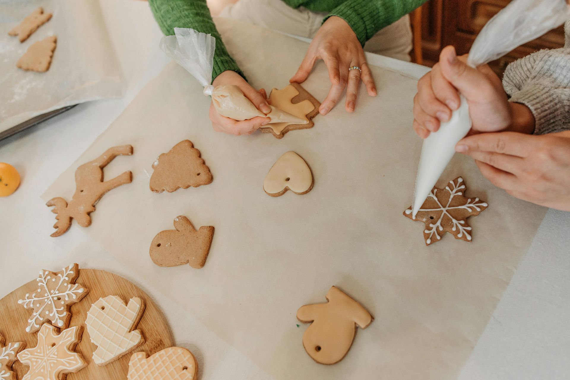 People working on decorating sugar cookies.