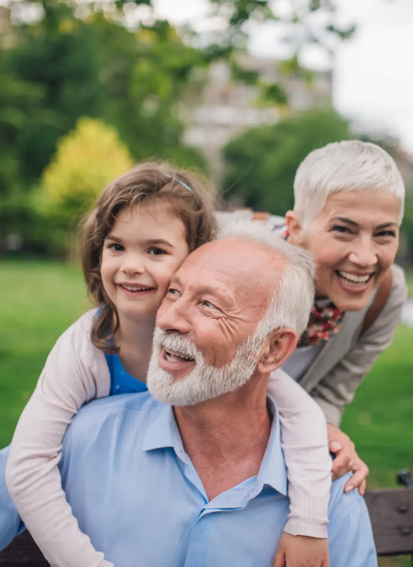 Happy senior couple and grandchild representing secure Medicare coverage in Louisiana