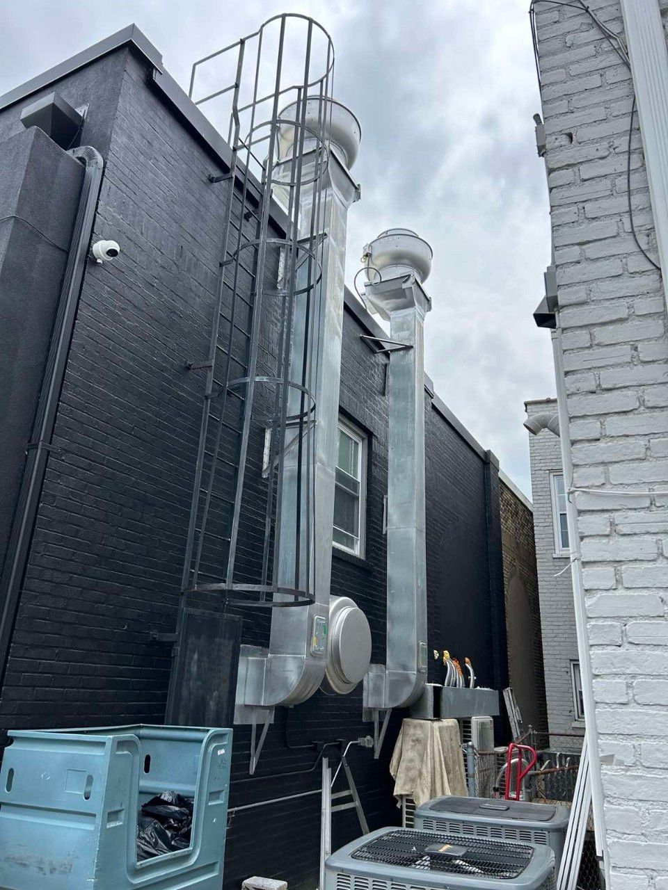 A ladder is attached to the side of a building.