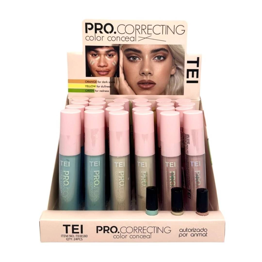 Exhibición de correctores de color TEI Pro Correcting en una tienda, con tubos de color rosa y azul, y dos modelos.