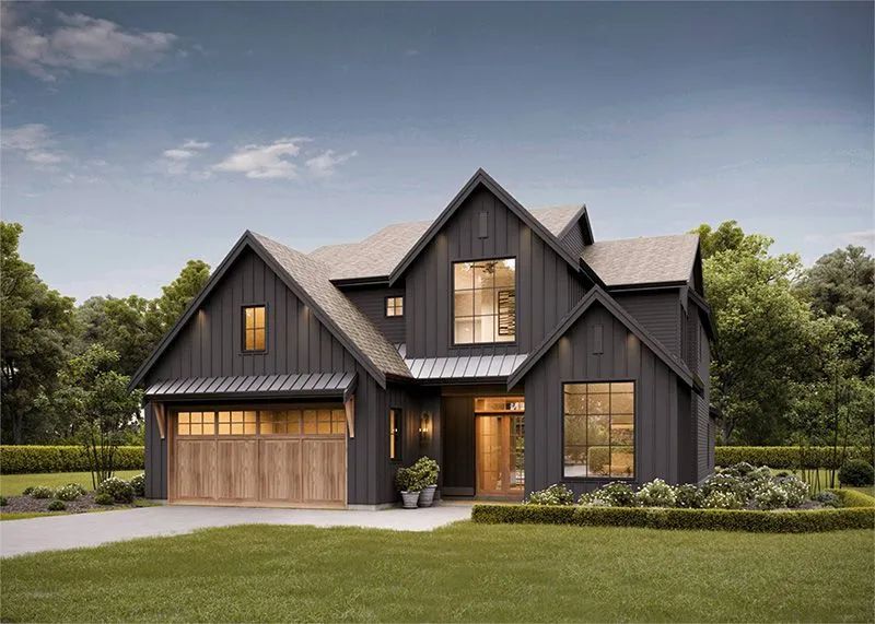 Modern farmhouse with dark gray siding, wooden garage door, and manicured landscaping.