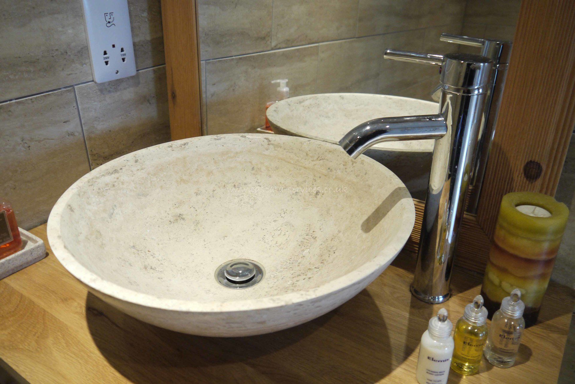 natural stone carved basin with pillar tap oak vanity unit