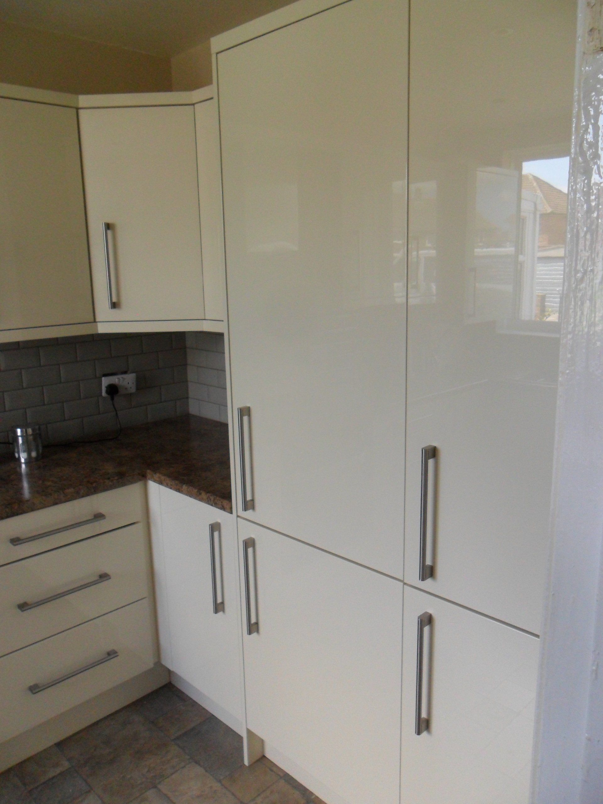 new kitchen grey antique crackle wall tiles gloss cream cabinets Axiom worktop integrated fridge freezer tall larder