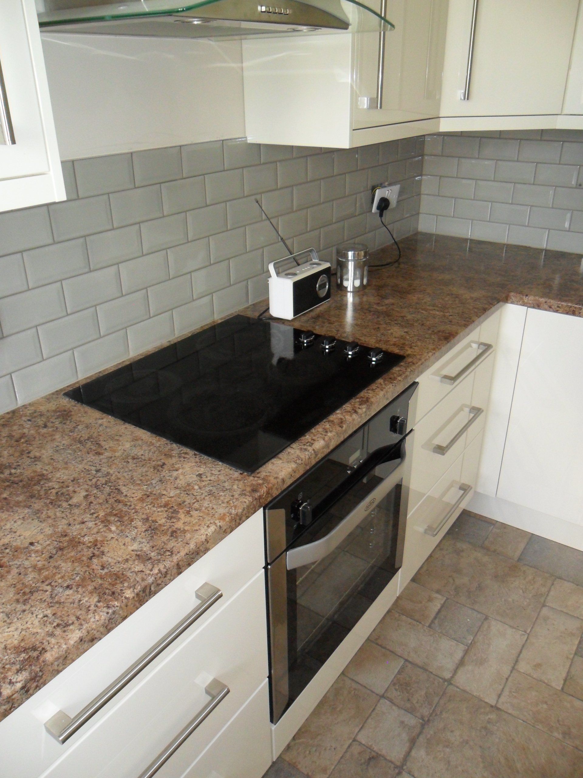 new kitchen grey antique crackle wall tiles gloss cream cabinets Axiom worktop