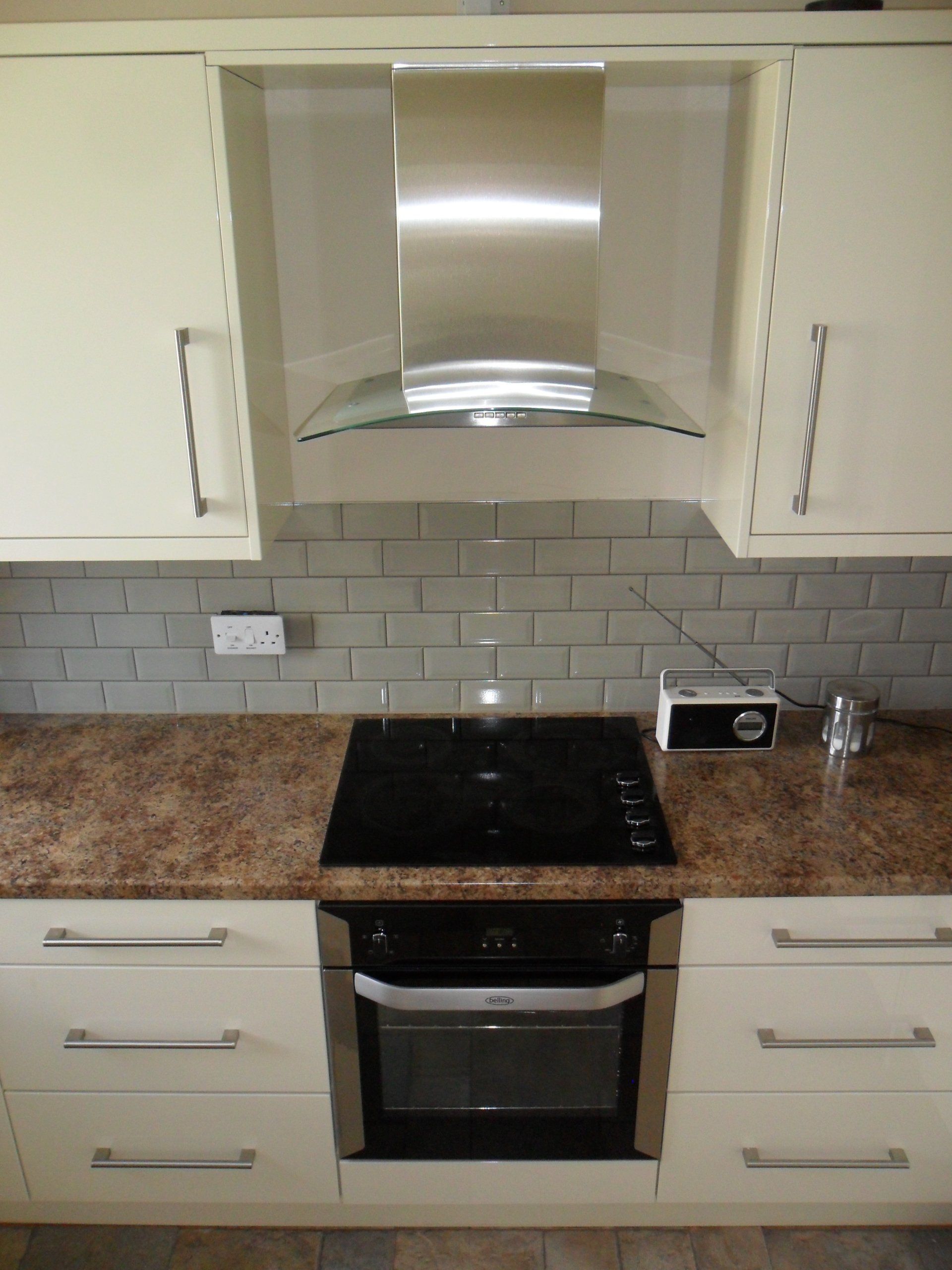 new kitchen grey antique crackle wall tiles gloss cream cabinets Axiom worktop belling single oven