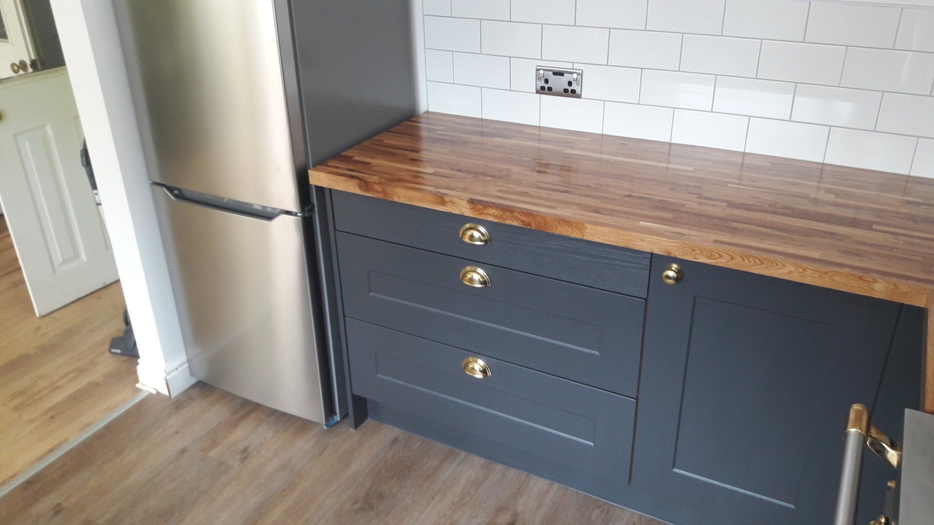 cascata new kitchen ink blue cabinets oak worktop drawers