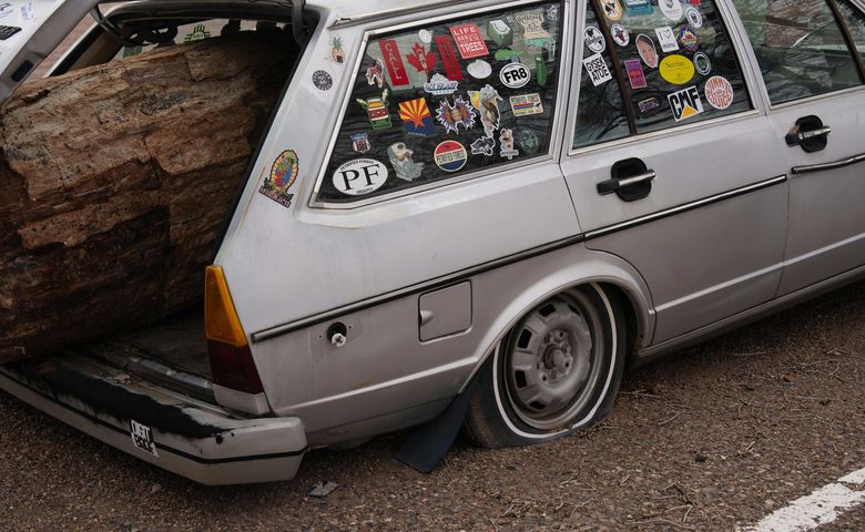 A car with a sticker on the window that says pt