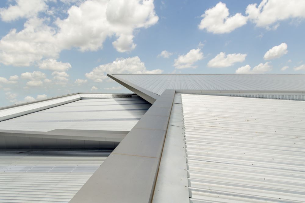 A White Roof With a Blue Sky in the Background — Timms Roofing In Barrack Heights, NSW
