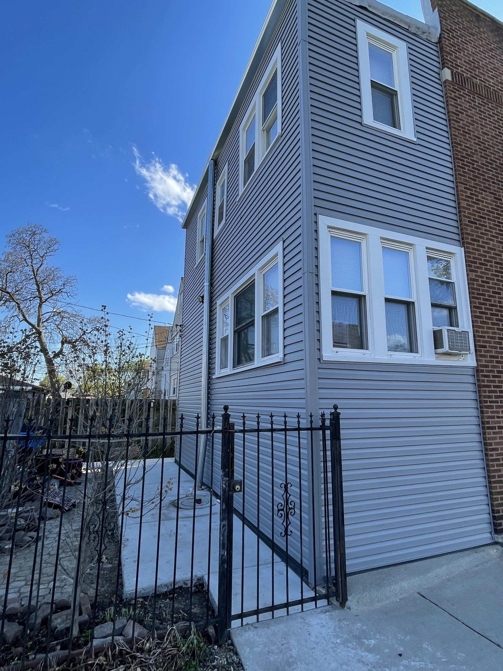 A house with a fence in front of it