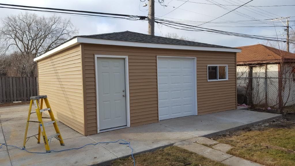 A garage with a garage door and a ladder in front of it.