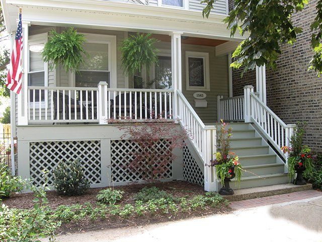 The front of a house with a porch and stairs