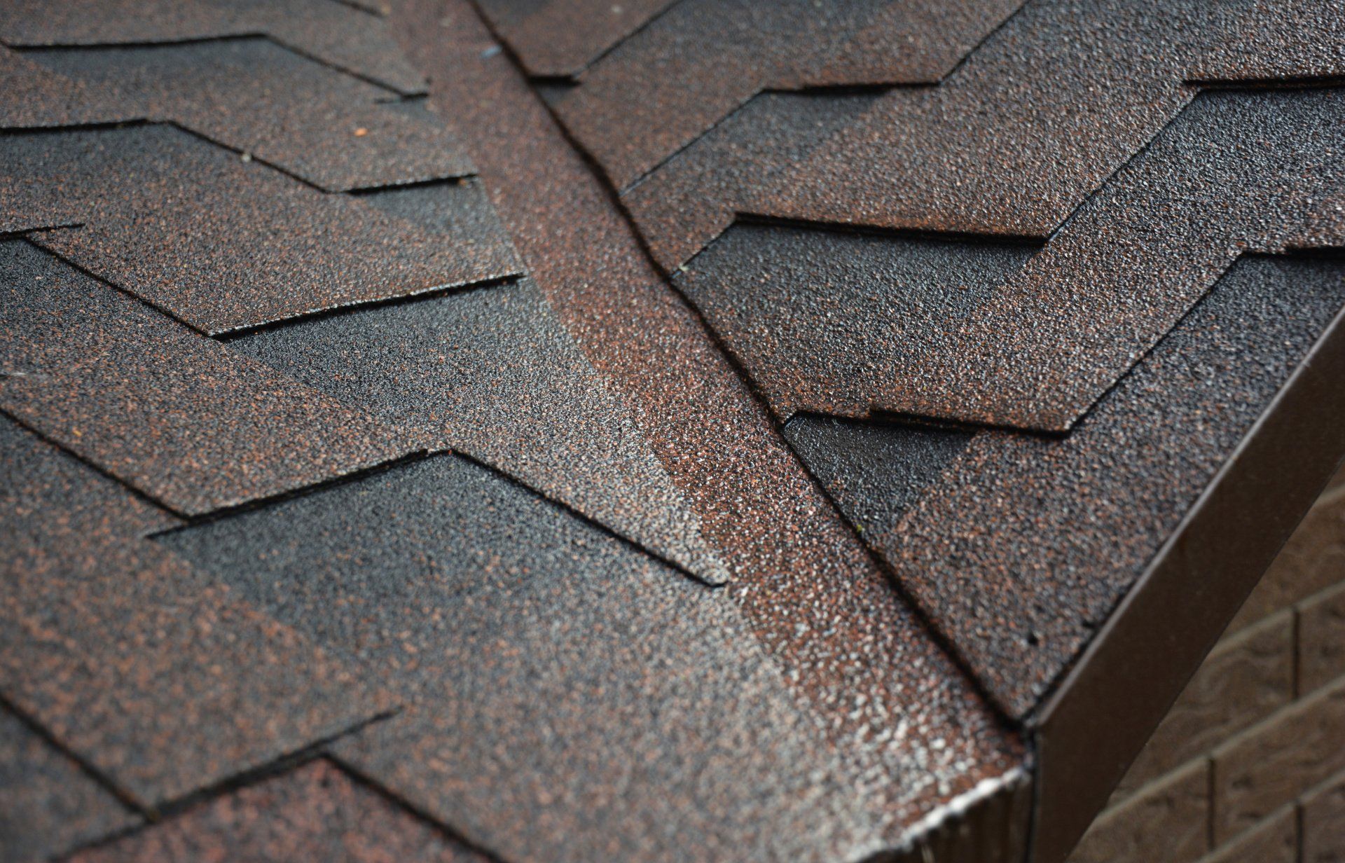 A close up of a roof with shingles on it.