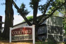 Courtyard Apartments property sign