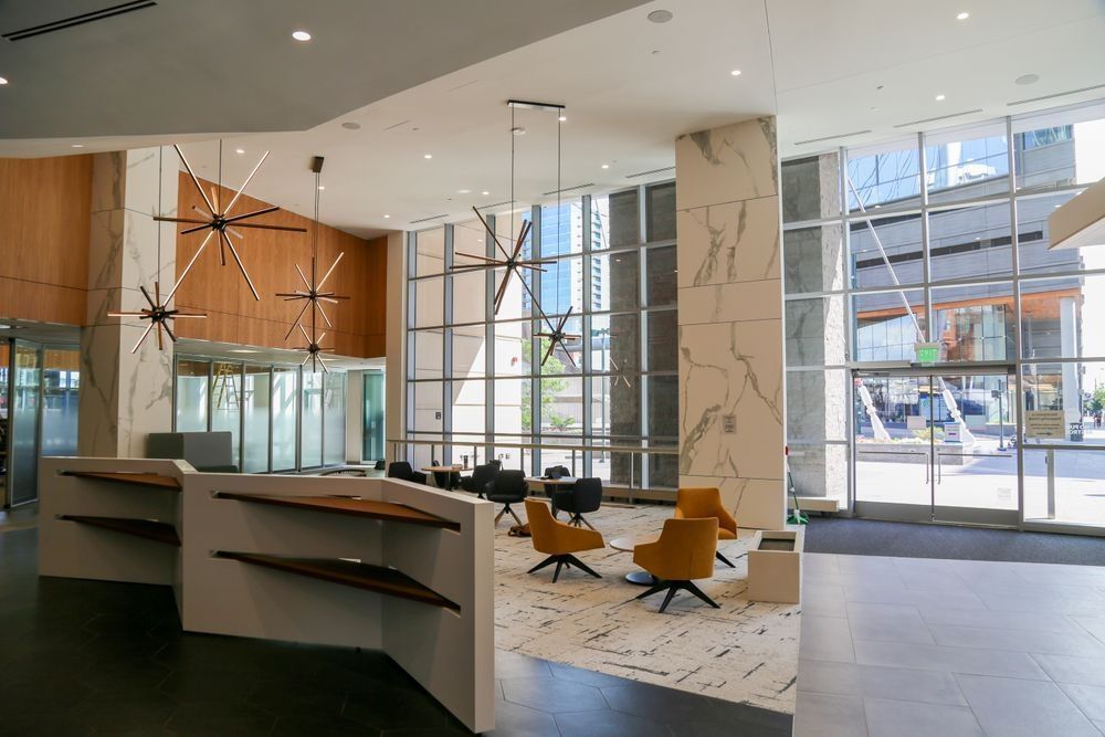 A large lobby with a lot of windows and chairs