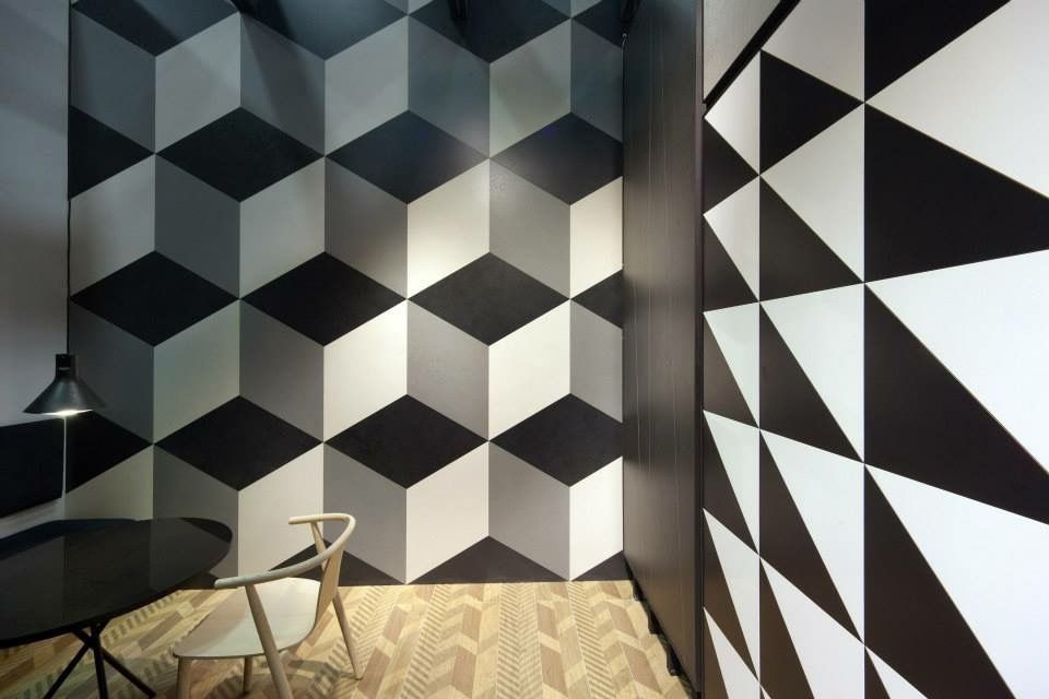 A black and white room with a table and chairs