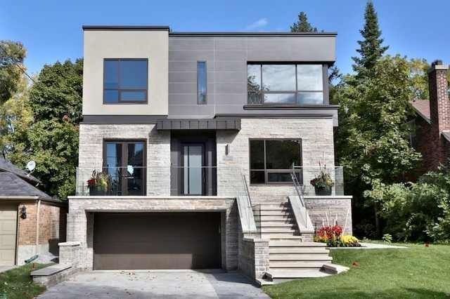 A modern house with a large garage and stairs