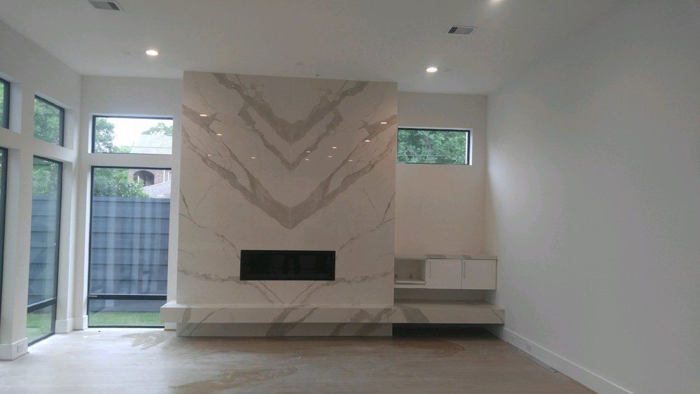 There is a fireplace in the middle of the room