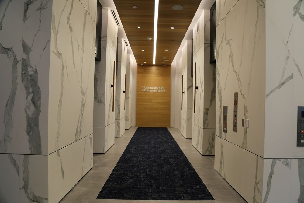 A long hallway with a black carpet