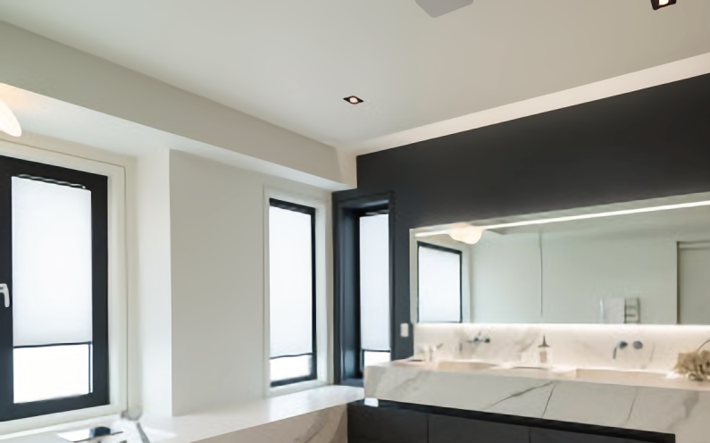 A bathroom with two sinks and a large mirror