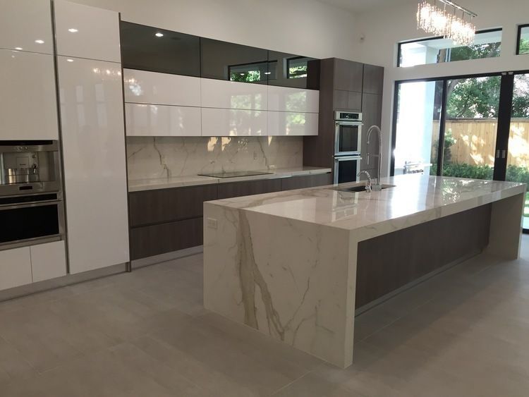 There is a large island in the middle of the kitchen