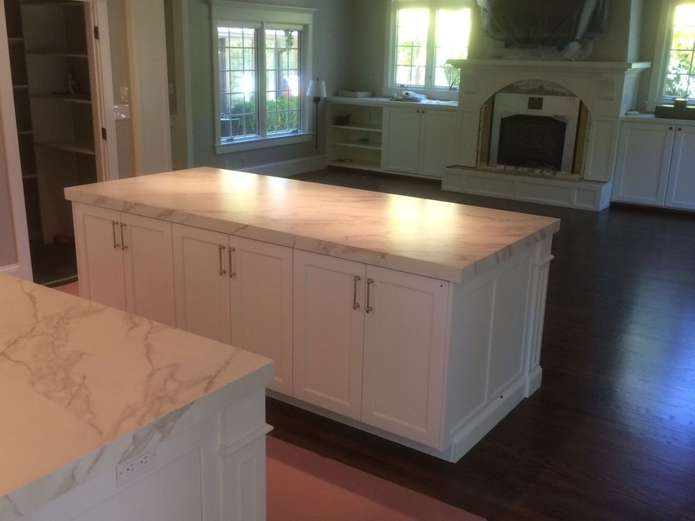 There is a large island in the middle of the kitchen