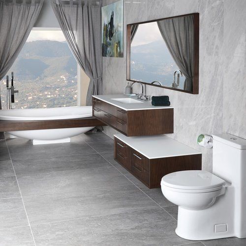 A bathroom with a toilet, sink, tub and mirror