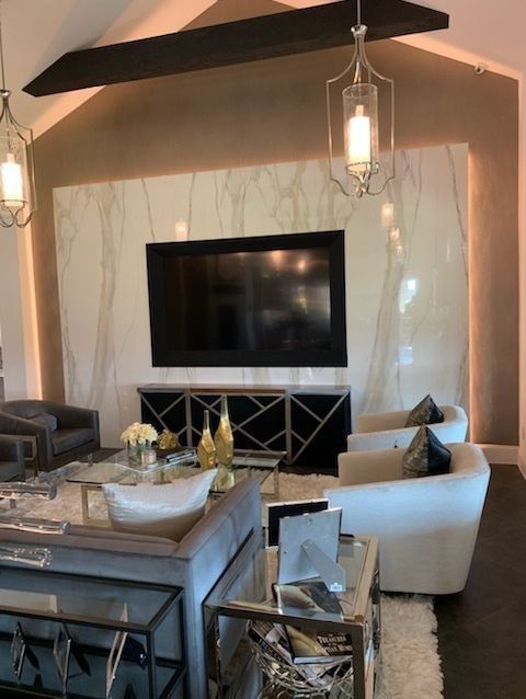 A living room with a flat screen tv on the wall