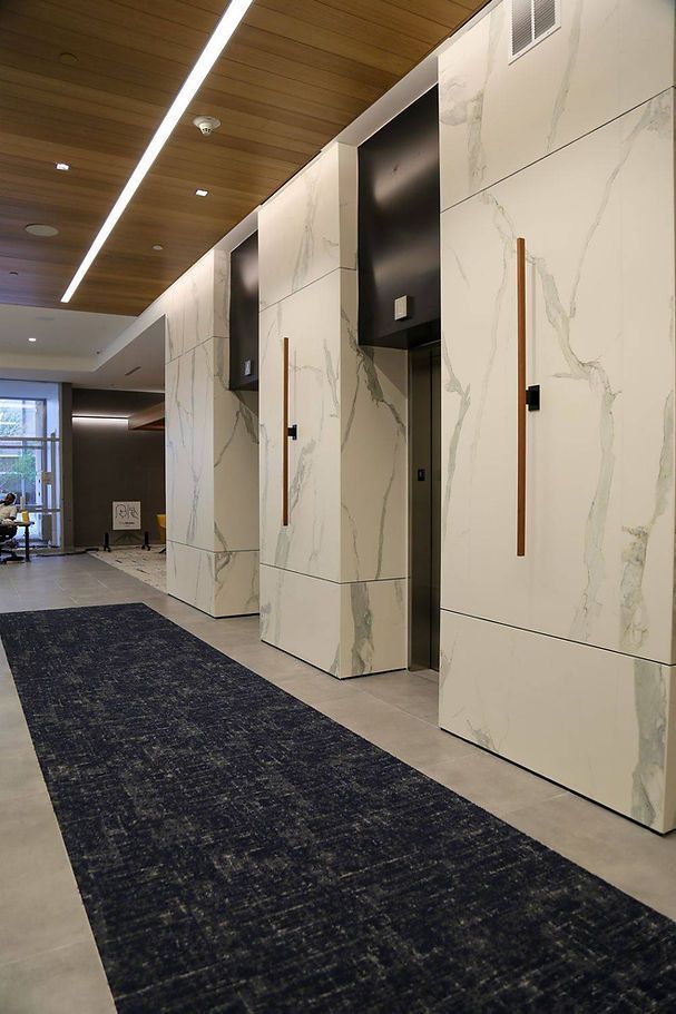 A hallway in a building with a carpet