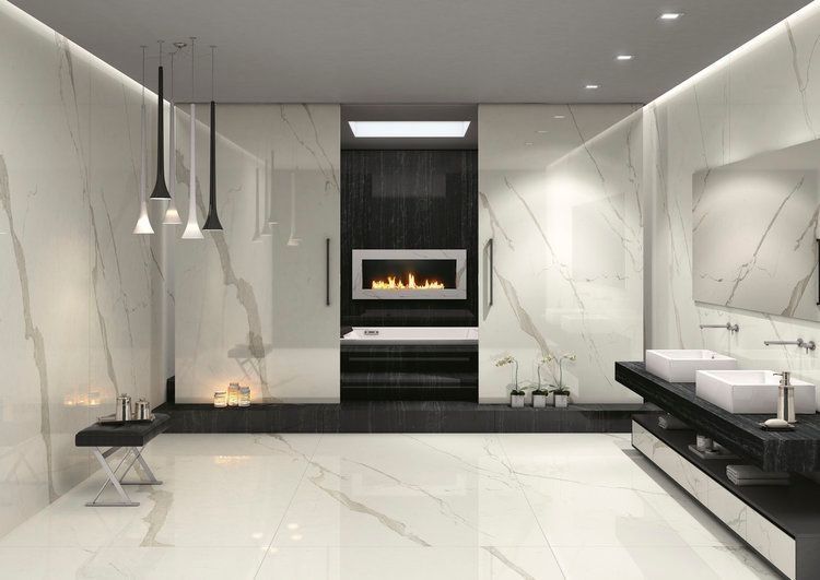 A bathroom with two sinks and a fireplace