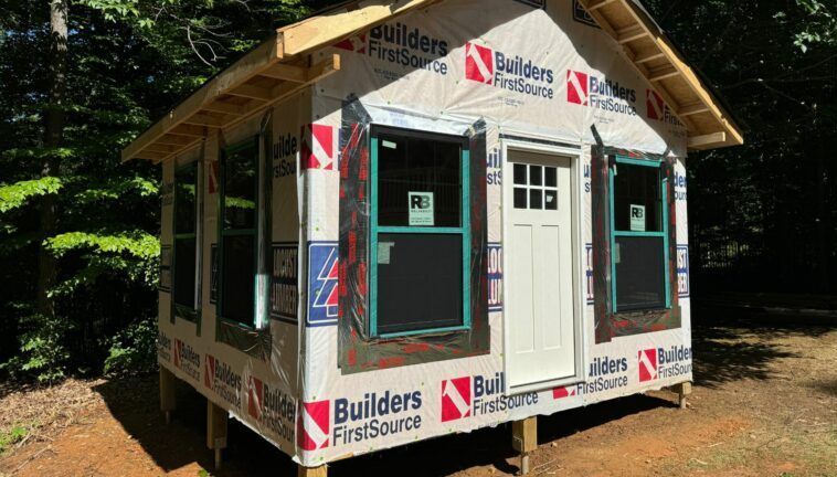A small house is being built with builders firstsource insulation.